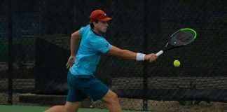 Brandon Holt returns the ball in matchplay during the 2020 Oracle ITA Masters by UTR